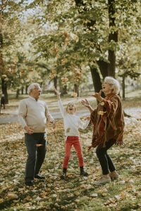 Grandparents enjoying good time with their little granddaughter
